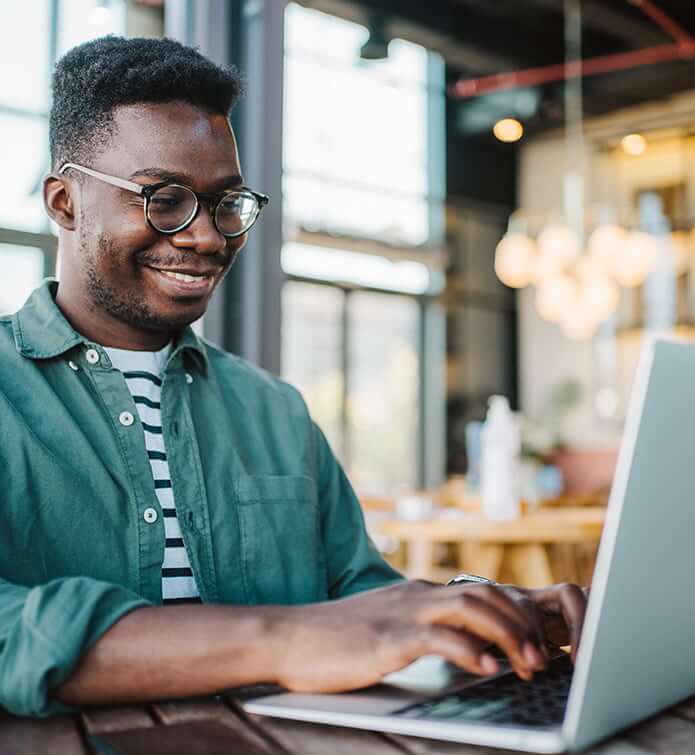 smiling man at a computer