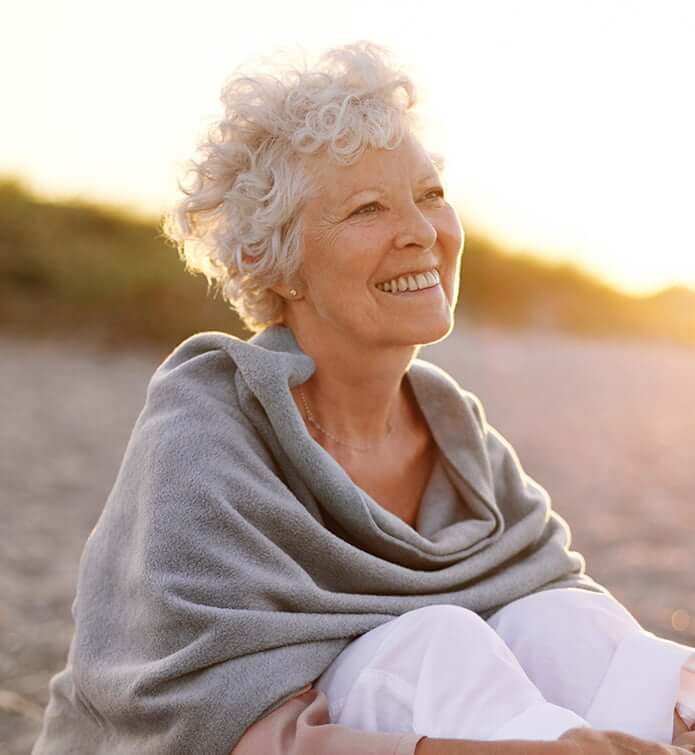 senior woman relaxing on the beach