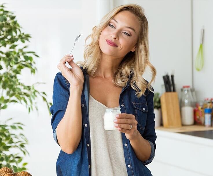 woman eating yogurt