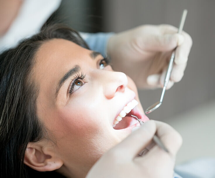 dentist examining a patient's teeth