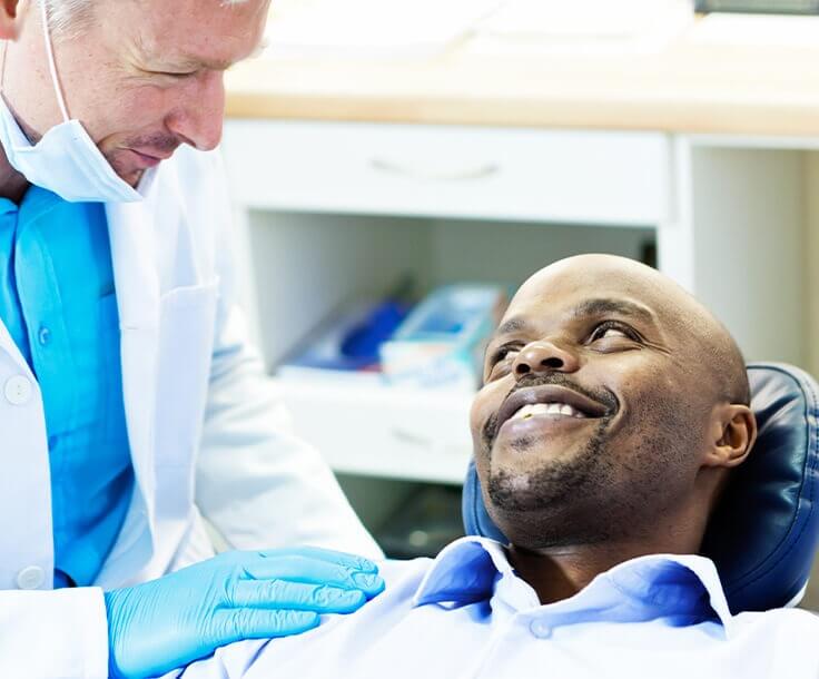 man speaking with his dentist