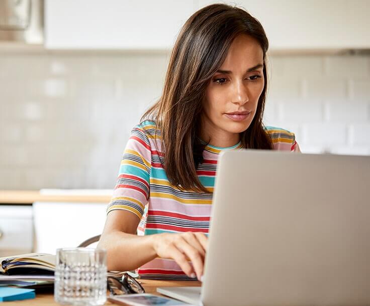 woman looking at her laptop