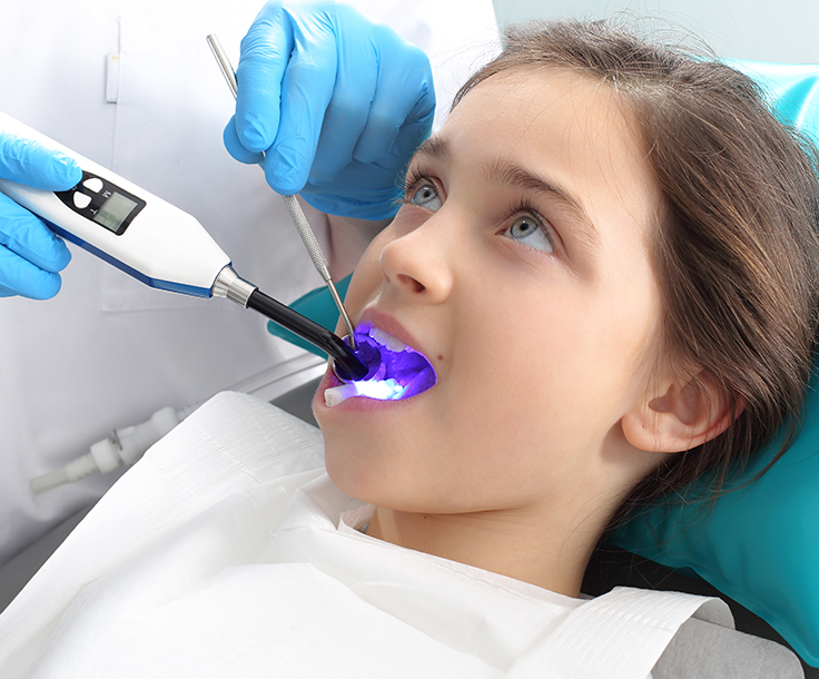 young girl at the dentist